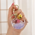Luminous whale oil bottle keychain with purple glitter and golden bell accessory - Luminous Purple