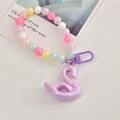 Detail of colorful acrylic beads and aurora swan pendant on a macaron beaded chain - Buckle Chain With Swan / Purple