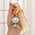 Macro view of glowing iridescent rabbit keychain with colorful gradient silicone strap - Brown