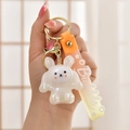 Detail of cute acrylic glowing rabbit keychain with orange gradient Bubble wrist strap - White
