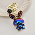 Macro detail of rainbow electroplated bunny keychain with LOVE text and golden ring - Light Gold Buckle + Rabbit + Bell / Black
