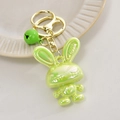 Fluorescent green acrylic rabbit keychain with LOVE engraving and gold metal bell - Light Gold Buckle + Rabbit + Bell / Fruit Green