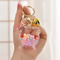 Acrylic liquid keychain with pink astronaut and colorful jelly beans in alarm clock bottle - Alarm Clock Bell Pink