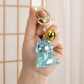 Porte-clés licorne bleu irisé avec clochette dorée et fermoir mousqueton en métal - Bleu