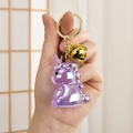 Porte-clés licorne violet translucide avec clochette dorée et finition résine pailletée - Violet
