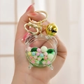 Pink alarm clock shaped acrylic liquid keychain with colorful beads and gold bell charm - Alarm Clock Bell Green