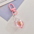 Acrylic seashell keychain with pink liquid, glitter and metal lobster clasp for bags - Pink
