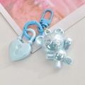 Macro shot of colorful iridescent bear and heart-shaped lock acrylic charms on blue D-ring - D-Buckle+Color Ring+Heart Lock+Bear / Iridescent Blue