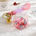 Cute acrylic pig keychain with pink fluid glitter and a gradient silicone wrist strap - Alarm Clock Pink