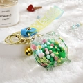 Transparent acrylic pig keychain with colorful bubble beads and gold lobster clasp - Alarm Clock Green