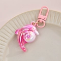 Macro detail of 3D iridescent pink dolphin pendant with glossy metallic D-ring clasp - Spring Hook + Dolphin / Pink