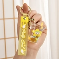 Dettaglio portachiavi liquido sabbie mobili stella gialla con tazza di tè e glitter - Giallo Limone