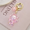 Porte-clés ours rose translucide avec boule scintillante et mousqueton doré chic - Rose