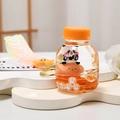 Creative panda floating liquid keychain with orange oil and yellow strap in bright scene - Bottle Strap Style / Orange