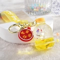 Cute bunny liquid quicksand keychain in yellow with lucky charm and silicone strap - Bunny Soda Bottle / Lemon Yellow