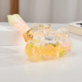 Macro detail of motorcycle drift bottle keychain with golden star glitter and sand - Lemon Yellow