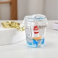 Detailed view of nautical keychain with lighthouse, blue liquid and silver glitter - Heart Cup Shape