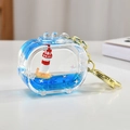 Flüssiger Acryl-Leuchtturm-Schlüsselanhänger mit blauem Treibsand und Goldring - TV-Form