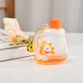 Close-up of a fox liquid quicksand keychain with orange fluid and a silicone strap - Orange Bottle Style