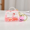 Cute pink liquid quicksand cat doll keychain with cherry blossoms in a mini bag shape - Cartoon Cat Mini Bag