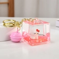 Cute pink liquid quicksand cube keychain featuring a cartoon cat figure and cherry blossoms - Cartoon Cat Square Bottle