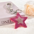 Macro detail of star keychain with pink rhinestones and silver tassel on plush background - Silver Clasp / Rose Red