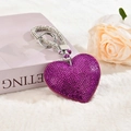 Detailed view of purple rhinestone heart keychain on soft plush surface with a rose - With Phone Patch [Purple]