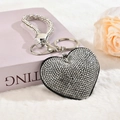Detailed view of heart-shaped rhinestone keychain with sparkling crystal wrist strap - Keychain [White Rhinestone Black Base]