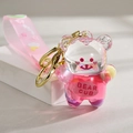 Schlüsselanhänger aus rosa Bär-Acryl mit Ölsand und sternenförmigem Armband - Rosa (Treibsand Bär)