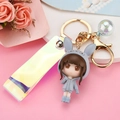 Cute bunny girl resin keychain with iridescent strap and golden metal clasp for bags - Gray