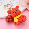 Red resin bear keychain with knitted texture yellow scarf and golden heart clasp - Red Bear