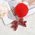 Portachiavi con pompon rosso e fiocco di strass su sfondo decorativo bianco morbido - Portachiavi+Fiocco+Pompon / Rosso