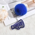 Porte-clés pompon bleu roi avec mégaphone en strass sur fond de fourrure blanche douce - Bleu Royal
