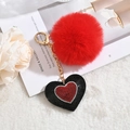 Red faux fur pompom keychain with rhinestone heart charm on a stylish background - Black Heart with Red Rhinestone