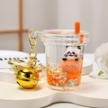 Panda liquid keychain in orange milk tea cup with star sequins and golden bell charm - Milk Tea Cup Bell Style / Orange