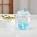 Portachiavi tè al latte blu con sabbie mobili, piccolo fucsia e anello in metallo - Stile Tazza di Tè al Latte Blu