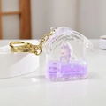 Purple house-shaped quicksand keychain with white fox figure and golden hook - Purple House Style