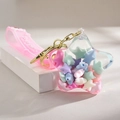 Acryl Stern Öl Schlüsselanhänger mit rosa Band und pastellfarbenen Sternen innen - Macaron Sternfüllung Stil