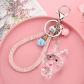 Details des rosa Hasen-Schlüsselanhängers aus Acryl mit Glitzerseil und blauem Sternanhänger - 4-teilige Kette + Kaninchen + Seil Perlen Glocke / Weiß