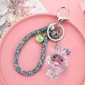 Hellblauer Kristall-Hasen-Schlüsselanhänger mit Strassband und silbernem Verschluss - 4-teilige Kette + Kaninchen + Seil Perlen Glocke / Hellblau