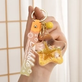 Stern-Schlüsselanhänger mit Treibsand, goldenem Seestern und orangefarbenem Armband - Gelb Seil Stern Stil