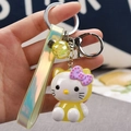 Hello Kitty keychain with yellow outfit, translucent ball, and holographic strap accessory - Cat [lemon Yellow]