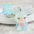 Light blue translucent fawn keychain with golden ring and matching rubber wrist strap - Glowing Deer [blue]