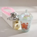 Blue miniature iced tea cup keychain with large pearl charm and pink glitter wrist strap - Glowing-in-the-dark Milk Tea Cup [blue]