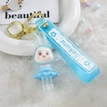 Sky blue glowing bunny keychain with Sakura wristlet and golden clasp on a white plate - Glowing-out Bunny [blue]