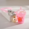 Pink glowing bunny drink cup keychain with sequins, floral patterns and pearl charm - Glowing-in-the-dark Milk Tea Cup [pink]