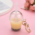 Macro detail of bubble tea keychain with moon clasp and colorful sprinkles - Moon Buckle + Milk Tea Cup / Light Yellow