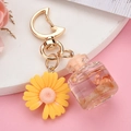 Detailed view of daisy charm keychain with crescent moon clip and glass wish bottle - Moon Buckle+Bottle+Flower / Lemon Yellow