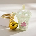 Mini green luminous tea cup keychain with glitter, pink flowers and large gold bell charm - Bell Style [Green]
