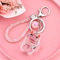 Porte-clés chat en cristal rose avec dragonne perlée et breloque planète - Chat de la Fortune Facetté Transparent Rose (Corde Rouge)